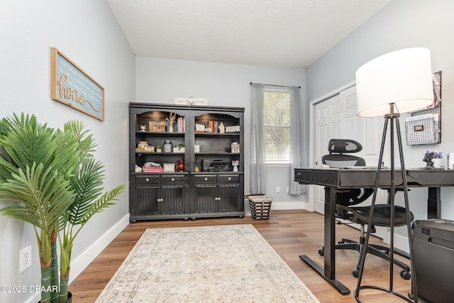 137 Boysenberry Ln, Daytona Beach, FL 32124 - home office featuring baseboards and wood finished floors