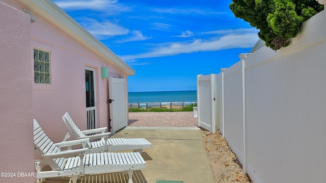 view of patio featuring a water view