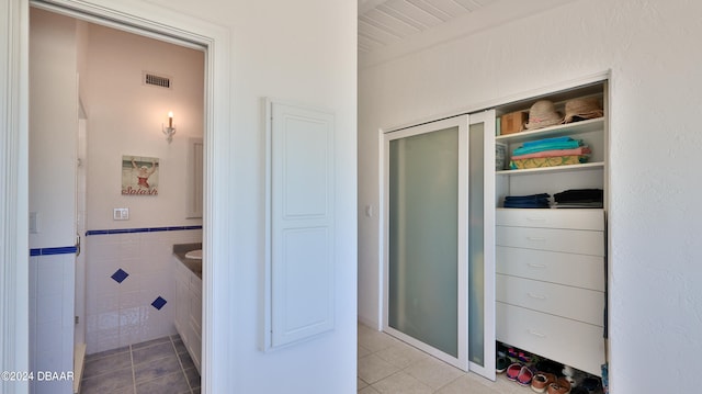 bathroom featuring tile walls and tile patterned floors