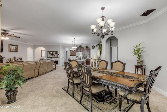 tiled dining area with ornamental molding, ceiling fan with notable chandelier, and sink