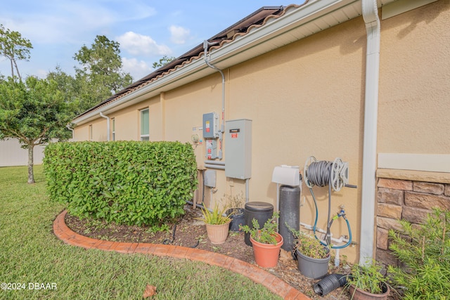 view of property exterior featuring a lawn