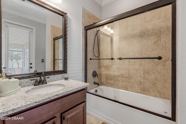 bathroom featuring vanity, bath / shower combo with glass door, tile patterned flooring, and crown molding