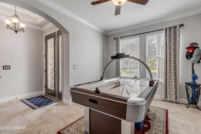 game room featuring ornamental molding, ceiling fan with notable chandelier, and light tile patterned floors