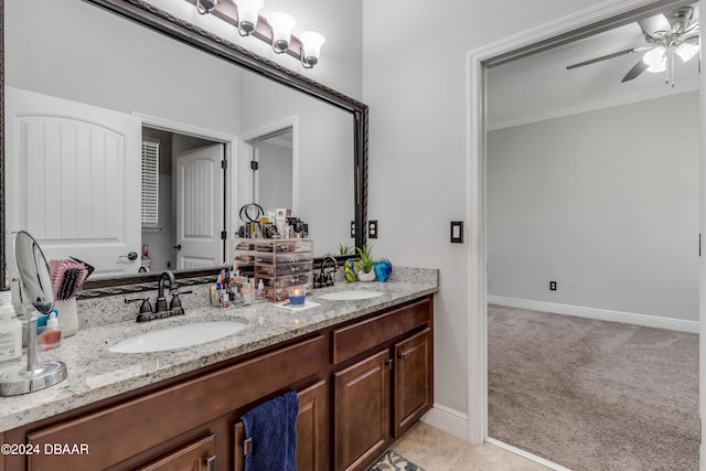 bathroom featuring vanity, tile patterned flooring, ceiling fan, and crown molding