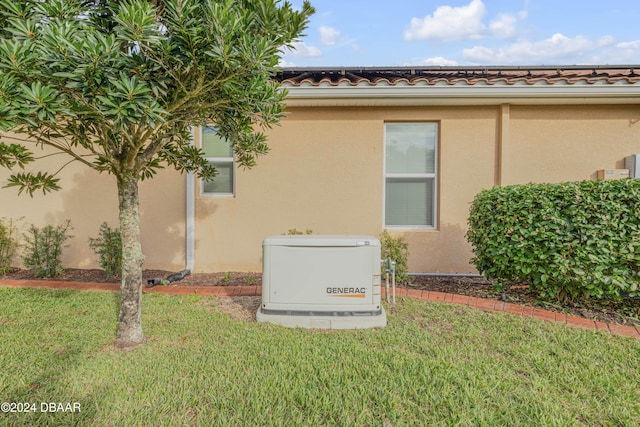 view of side of home featuring a lawn