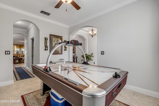 recreation room with light tile patterned flooring, an inviting chandelier, and ornamental molding