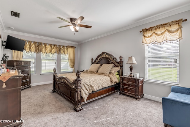 bedroom featuring ceiling fan, ornamental molding, and carpet