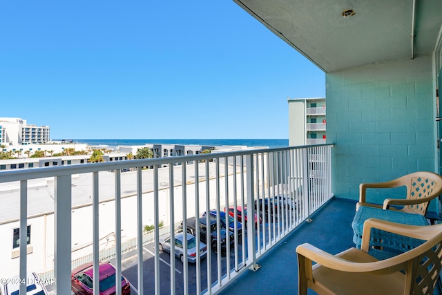 balcony featuring a water view