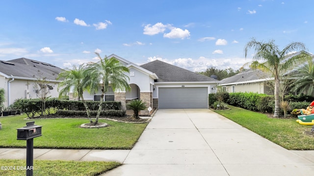 ranch-style home with a garage and a front lawn