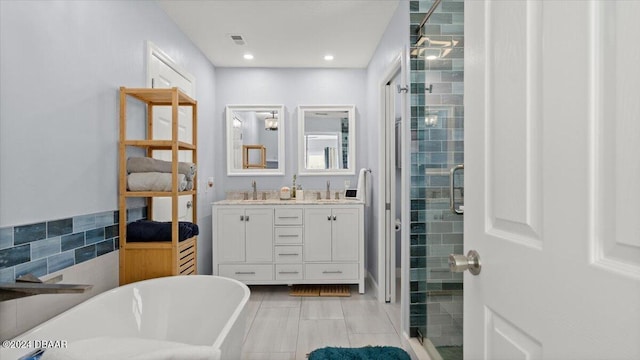 bathroom featuring separate shower and tub, tile patterned floors, vanity, and tile walls