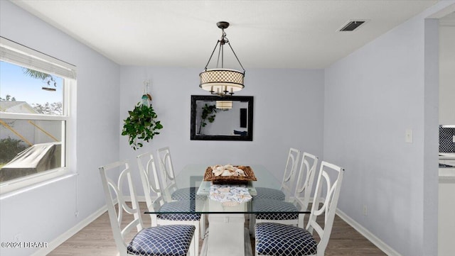 dining space featuring light hardwood / wood-style flooring