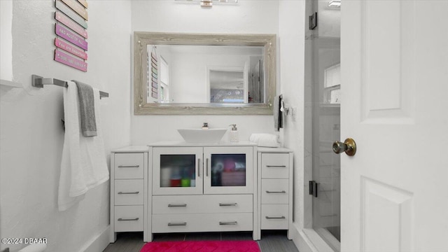 bathroom featuring a shower and vanity