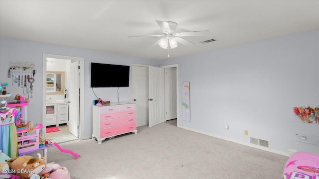 rec room with ceiling fan and light carpet