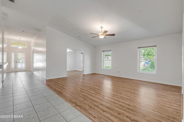 2853 Turnbull Estates Dr, New Smyrna Beach, FL 32168 - empty room with ceiling fan, lofted ceiling, and light hardwood / wood-style flooring