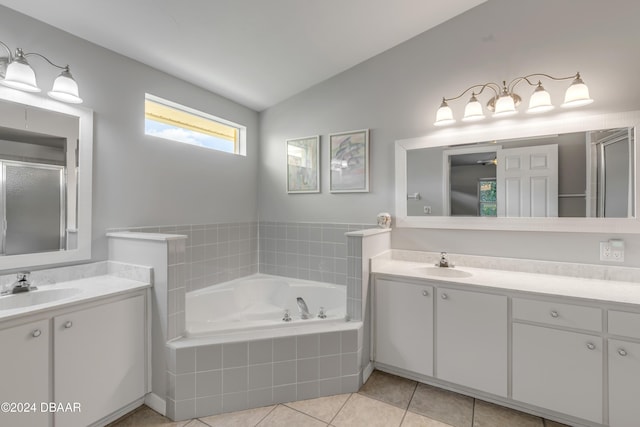 2853 Turnbull Estates Dr, New Smyrna Beach, FL 32168 - bathroom with tile patterned flooring, vanity, separate shower and tub, and lofted ceiling