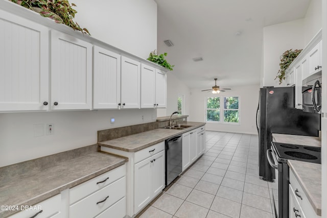 2853 Turnbull Estates Dr, New Smyrna Beach, FL 32168 - kitchen with appliances with stainless steel finishes, vaulted ceiling, ceiling fan, sink, and white cabinets