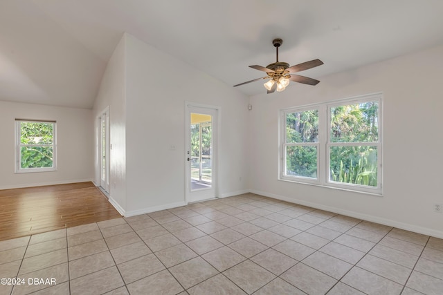 2853 Turnbull Estates Dr, New Smyrna Beach, FL 32168 - tiled empty room featuring ceiling fan, a healthy amount of sunlight, and lofted ceiling