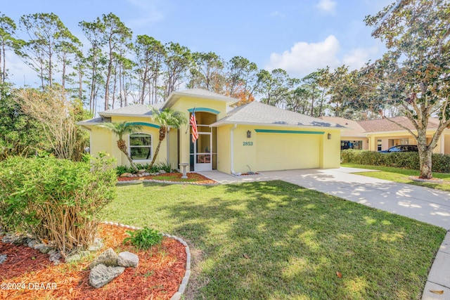 view of front of property featuring a garage and a front lawn