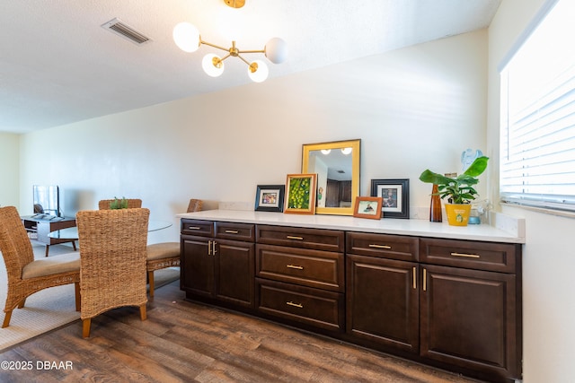 dining room with dark hardwood / wood-style flooring