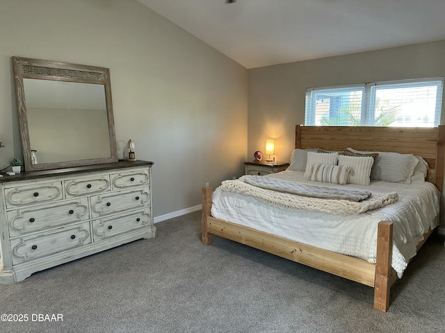 carpeted bedroom with vaulted ceiling