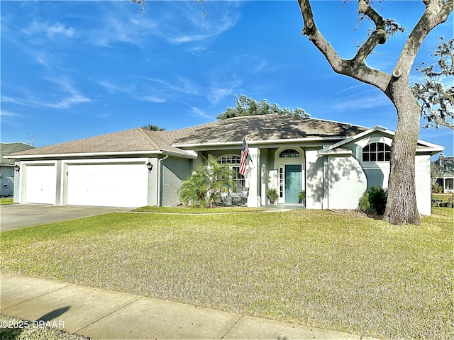 single story home with a garage and a front lawn