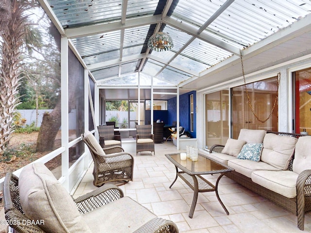 sunroom featuring lofted ceiling