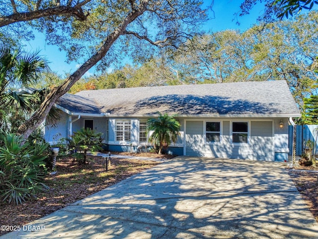 single story home featuring a garage