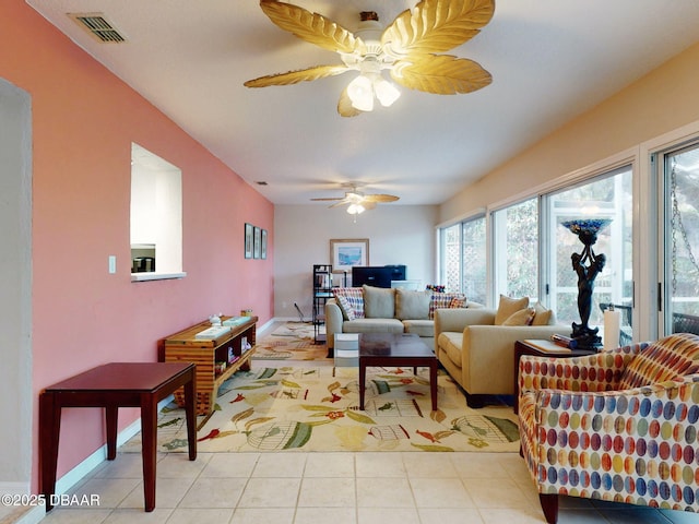 tiled living room with ceiling fan