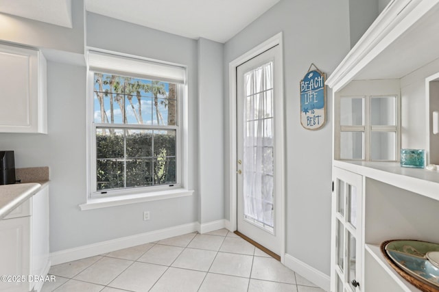 4650 Links Village Dr Unit B103, Ponce Inlet, FL 32127 - foyer entrance with healthy amount of natural light and light tile patterned flooring