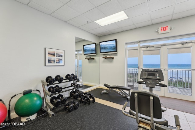 4650 Links Village Dr Unit B103, Ponce Inlet, FL 32127 - workout area with a paneled ceiling and baseboards