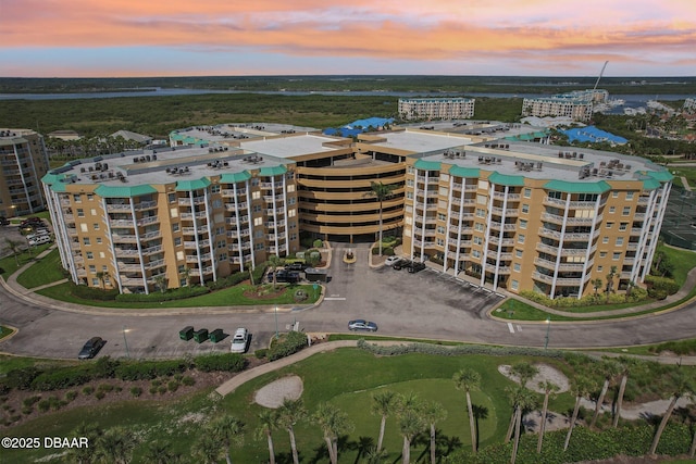 4650 Links Village Dr Unit B103, Ponce Inlet, FL 32127 - aerial view at dusk of a view of apartment building / complex and a water view