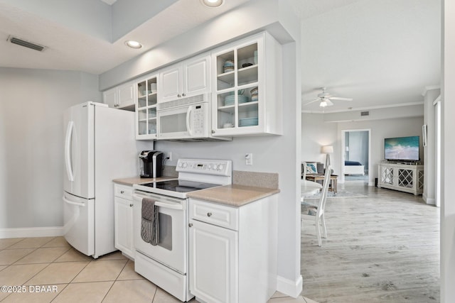 4650 Links Village Dr Unit B103, Ponce Inlet, FL 32127 - kitchen with white appliances, light countertops, a ceiling fan, white cabinetry, and recessed lighting