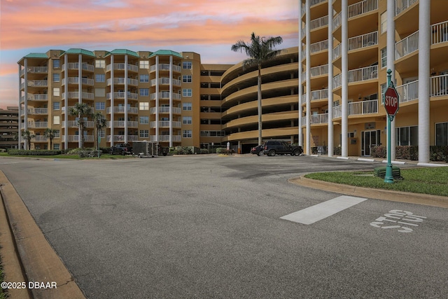 4650 Links Village Dr Unit B103, Ponce Inlet, FL 32127 - view of apartment building / complex featuring uncovered parking
