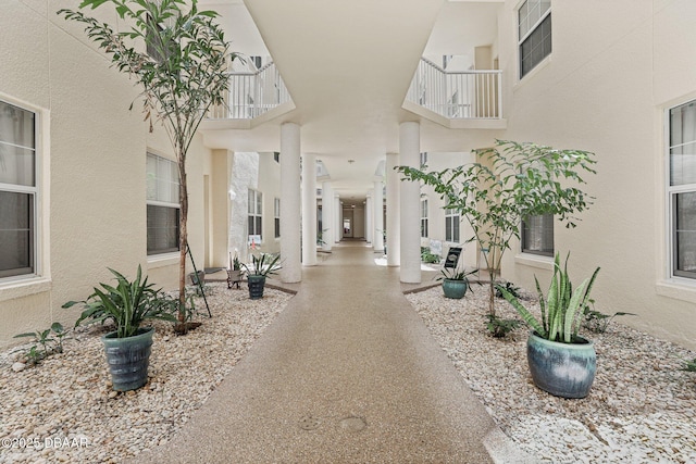 4650 Links Village Dr Unit B103, Ponce Inlet, FL 32127 - surrounding community featuring a high ceiling and a textured wall