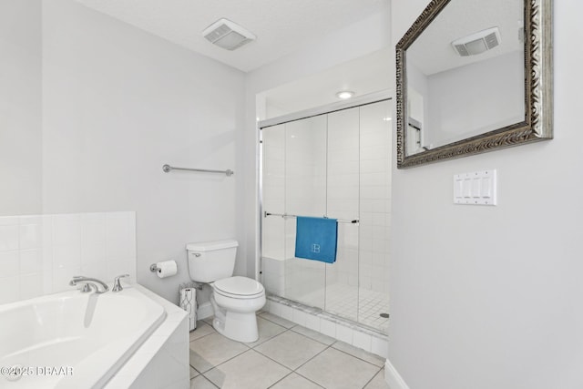 4650 Links Village Dr Unit B103, Ponce Inlet, FL 32127 - bathroom with a garden tub, a shower stall, and tile patterned floors