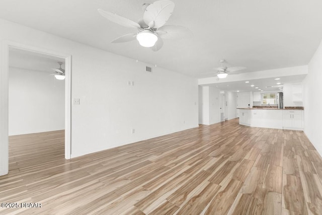 3807 S Atlantic Ave Unit 2020, Daytona Beach, FL 32118 - unfurnished living room with ceiling fan, light wood-style flooring, and recessed lighting