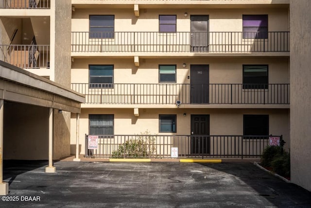 3807 S Atlantic Ave Unit 2020, Daytona Beach, FL 32118 - view of apartment building / complex with uncovered parking