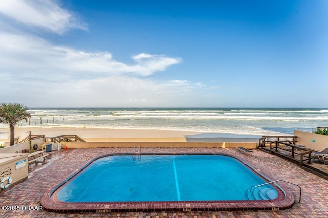 3807 S Atlantic Ave Unit 2020, Daytona Beach, FL 32118 - community pool featuring view of water and beach and a patio area