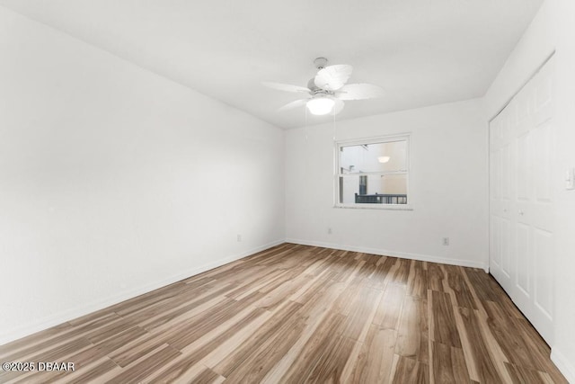 3807 S Atlantic Ave Unit 2020, Daytona Beach, FL 32118 - unfurnished room with wood finished floors and a ceiling fan