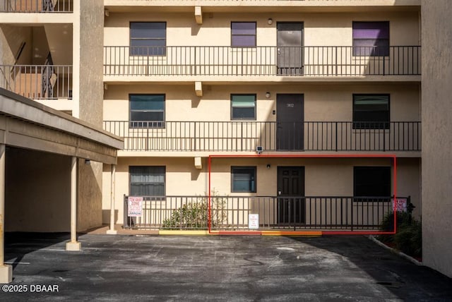 3807 S Atlantic Ave Unit 2020, Daytona Beach, FL 32118 - view of building exterior featuring parking