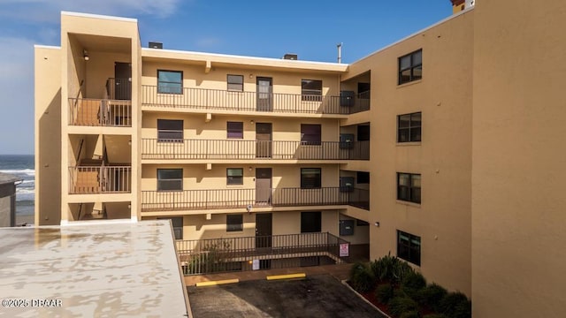 3807 S Atlantic Ave Unit 2020, Daytona Beach, FL 32118 - view of apartment building / complex with uncovered parking and a water view