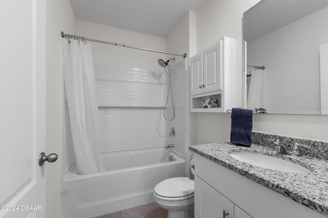 full bathroom with tile patterned floors, vanity, toilet, and shower / bath combo with shower curtain