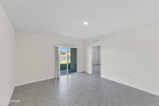 view of tiled spare room