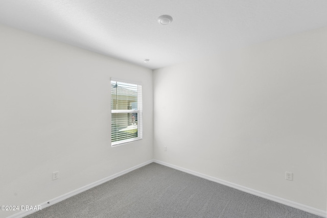 unfurnished room with carpet floors