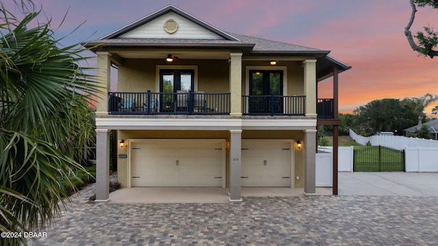 view of front of home featuring a garage and french doors