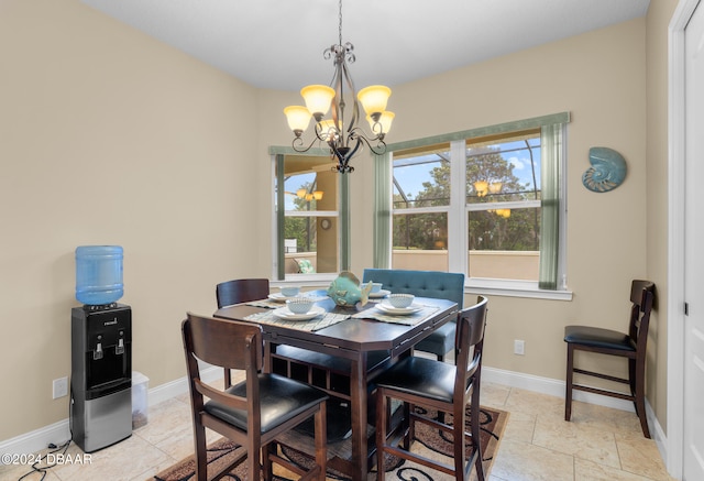 dining area featuring a notable chandelier