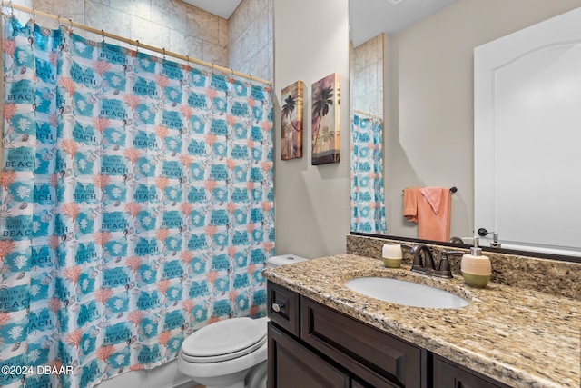 bathroom featuring vanity, toilet, and walk in shower