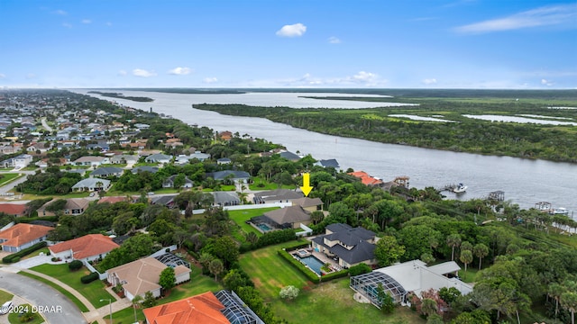 birds eye view of property with a water view