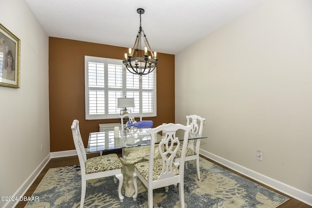 786 Jollymon Way, Daytona Beach, FL 32124 - dining area with a chandelier, wood finished floors, and baseboards