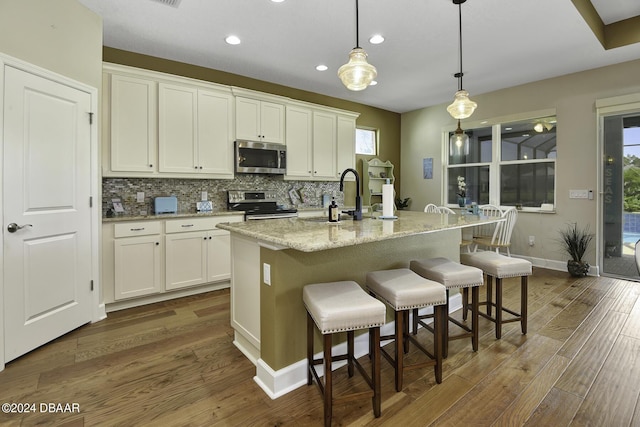 786 Jollymon Way, Daytona Beach, FL 32124 - kitchen featuring stainless steel appliances, a sink, dark wood-style floors, white cabinets, and recessed lighting